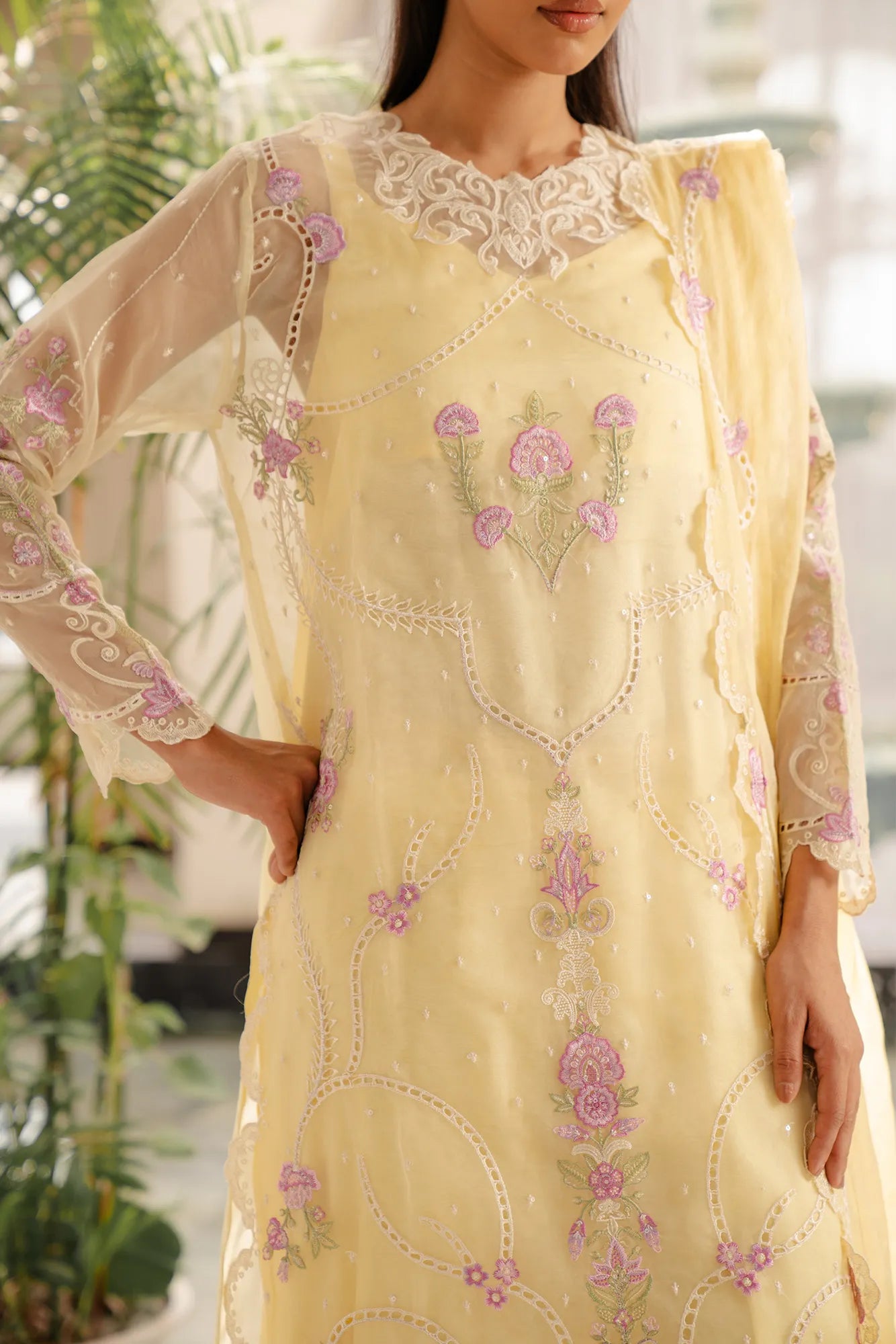Elegant organza fabric suits in Pakistan with tiered hem