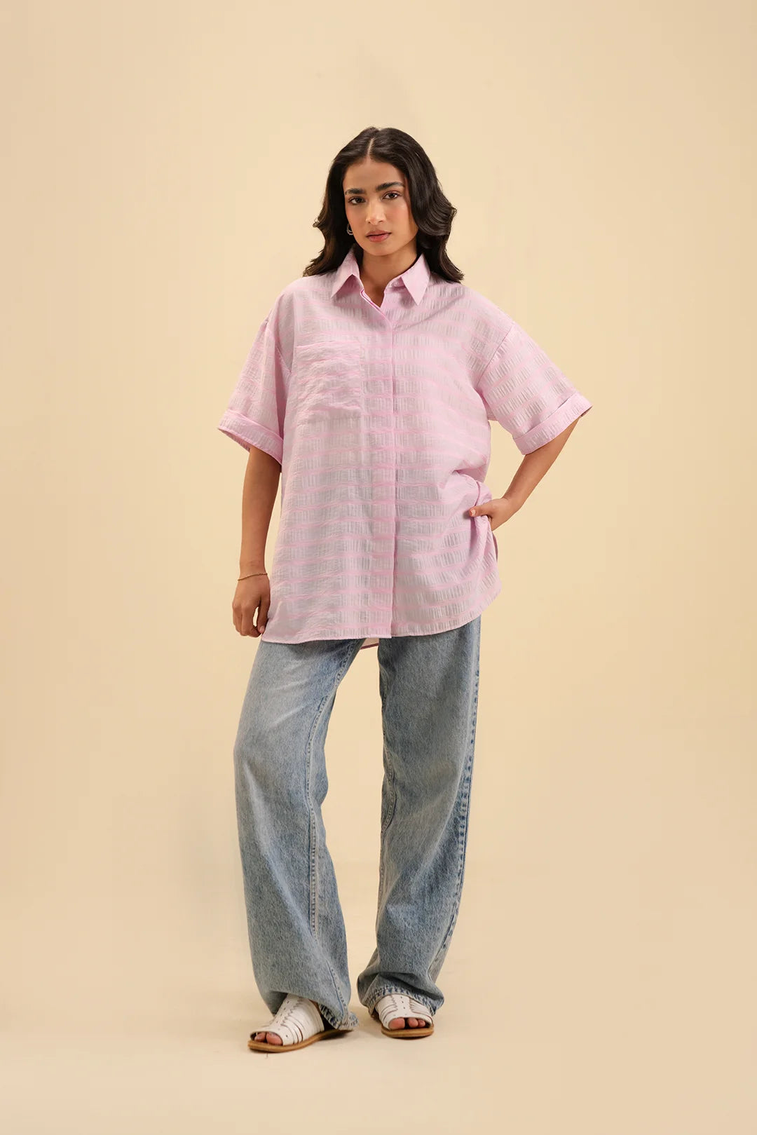 Elegant pink button-down shirt – a versatile wardrobe essential for women.