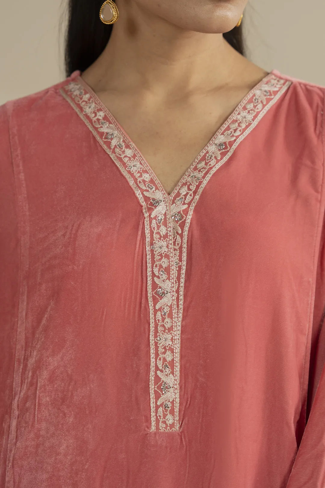 Embroidered cuff detail on soft peach velvet kaftan, winter festive wear