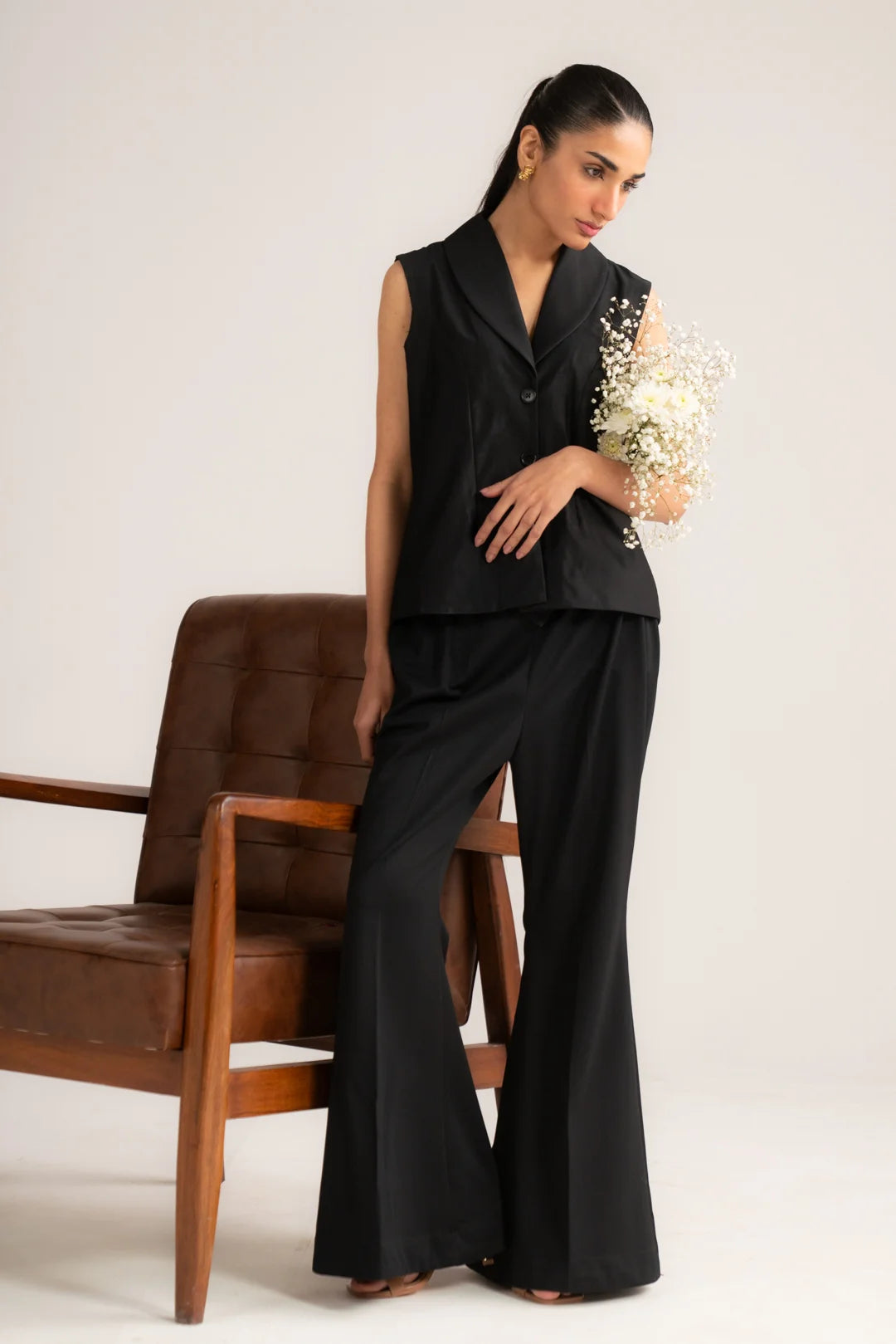 Front full-length view of black cropped vest co-ord set with wide-leg trousers for women
