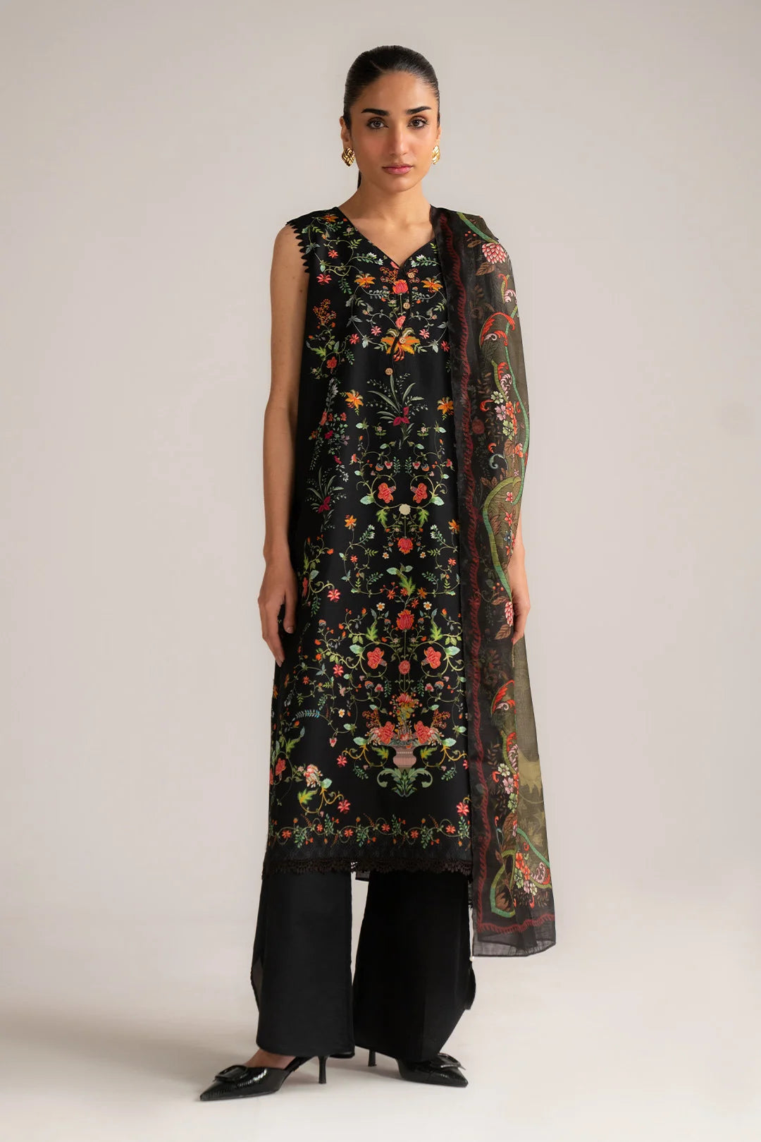 Front full-length view of black printed 3 piece lawn suit with dupatta