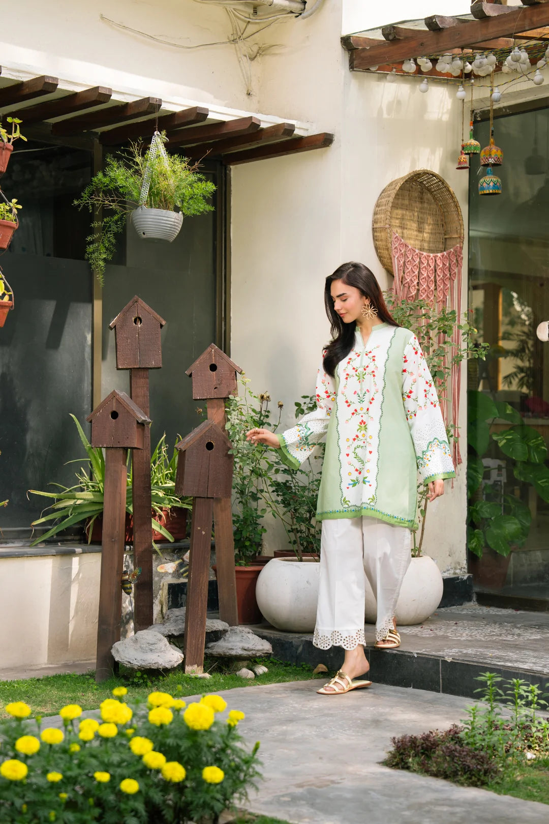 Front portrait of women’s light green printed cambric shirt