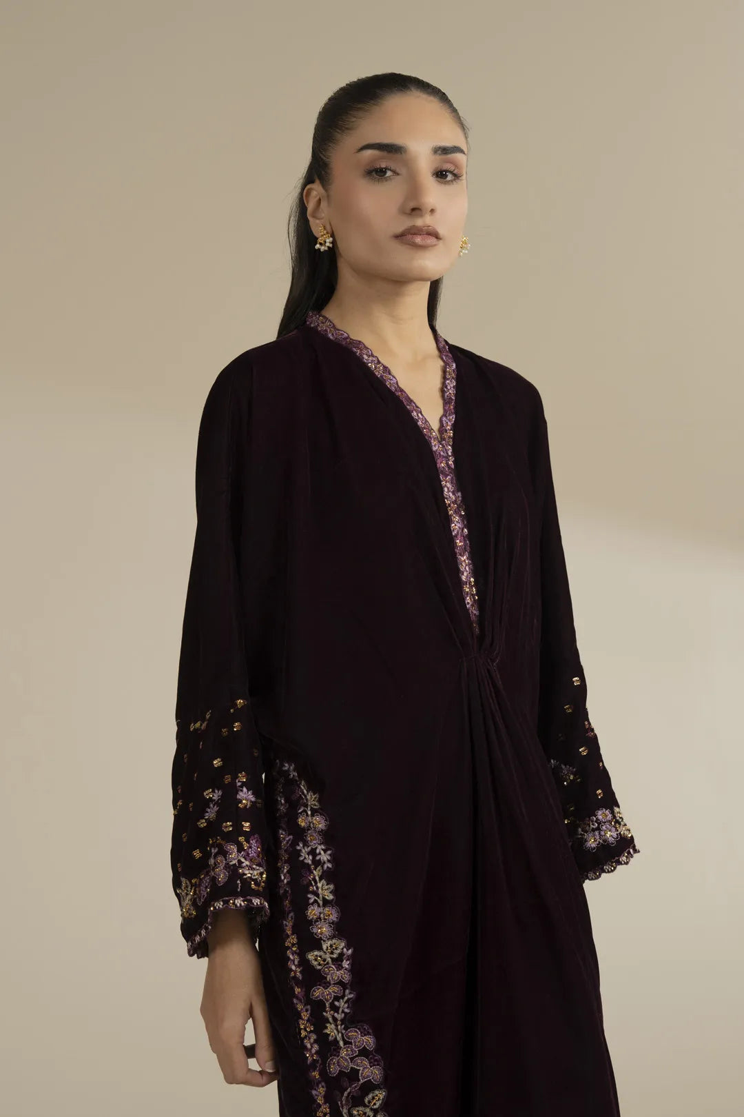 Front view of embroidered velvet kaftan highlighting neckline and relaxed silhouette