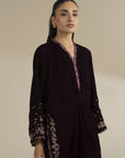Front view of embroidered velvet kaftan highlighting neckline and relaxed silhouette