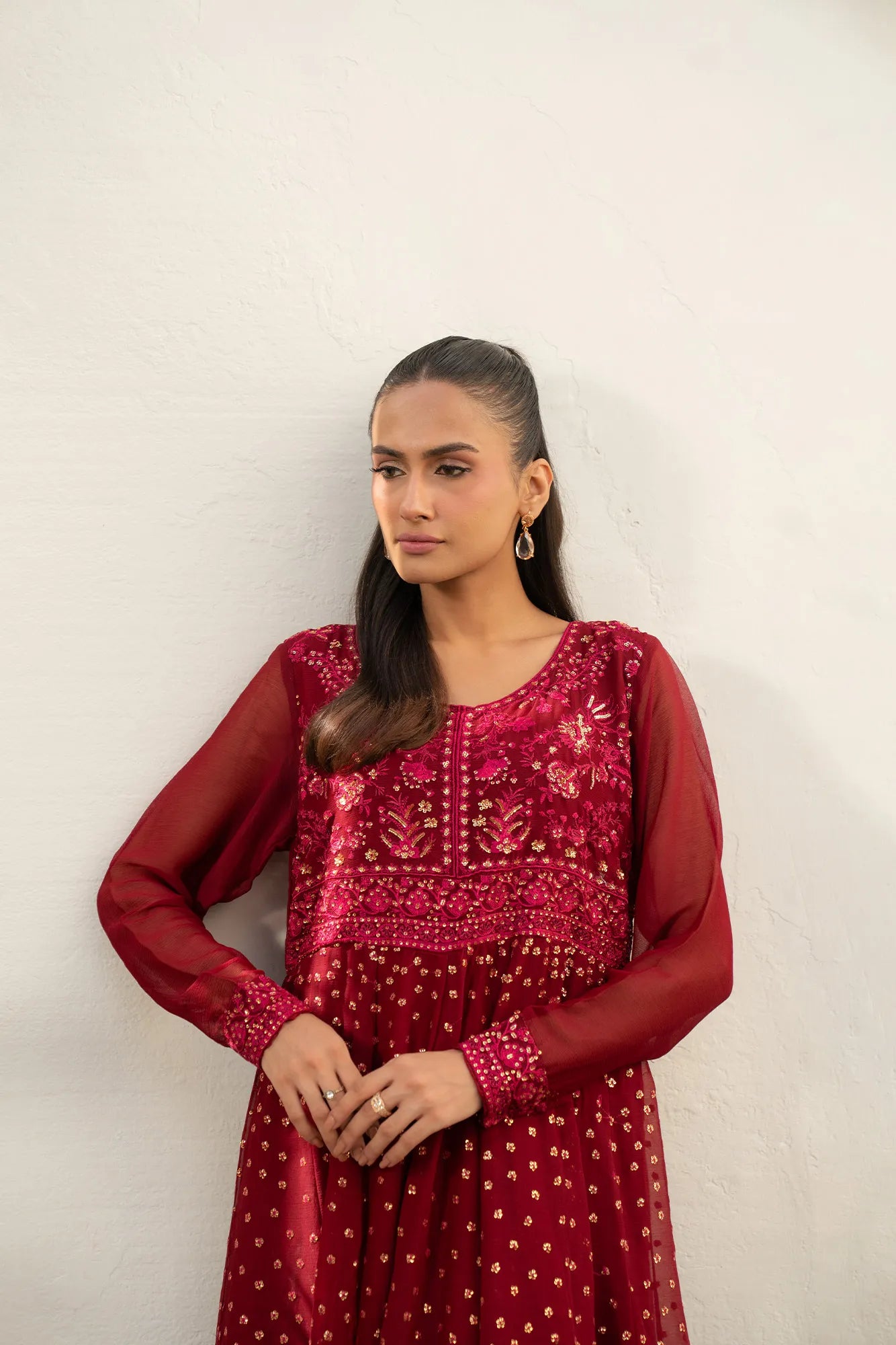 Front view of embroidery work on maroon chiffon shirt, festive look