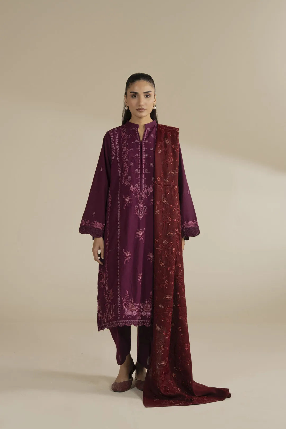 Front view of maroon formal embroidered shawl styled over outfit