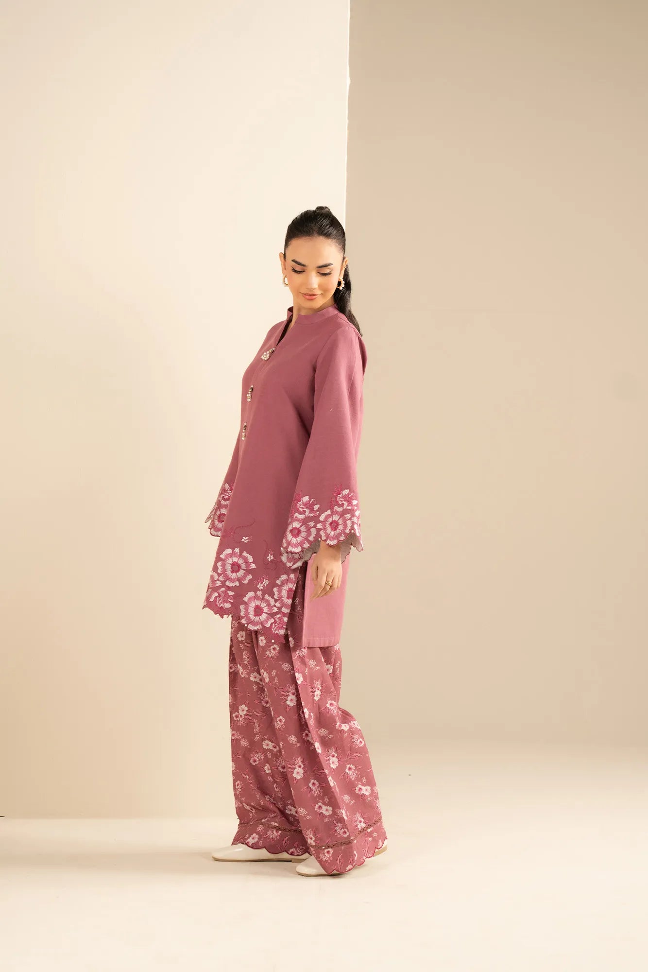 Front view of pink khaddar embroidered shirt with matching printed trouser