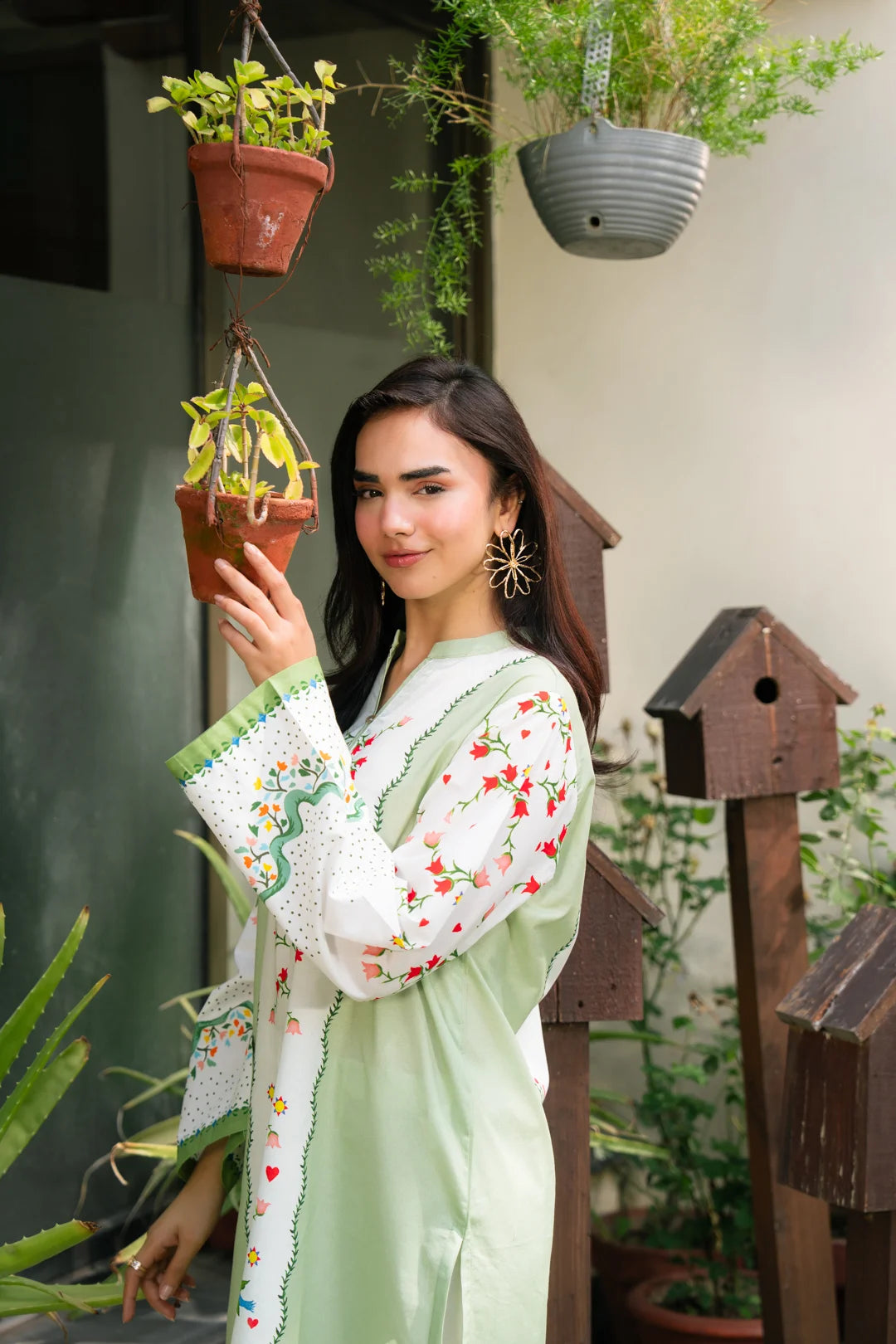 Full-body view of light green ready-to-wear cambric shirt with white trousers