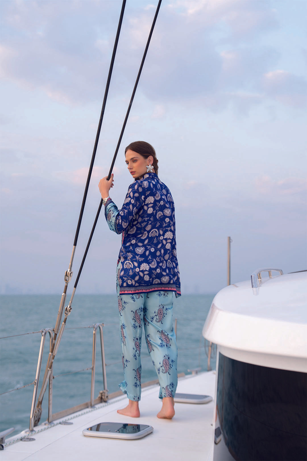 Full-body view of printed co-ord set near yacht mast with matching trousers