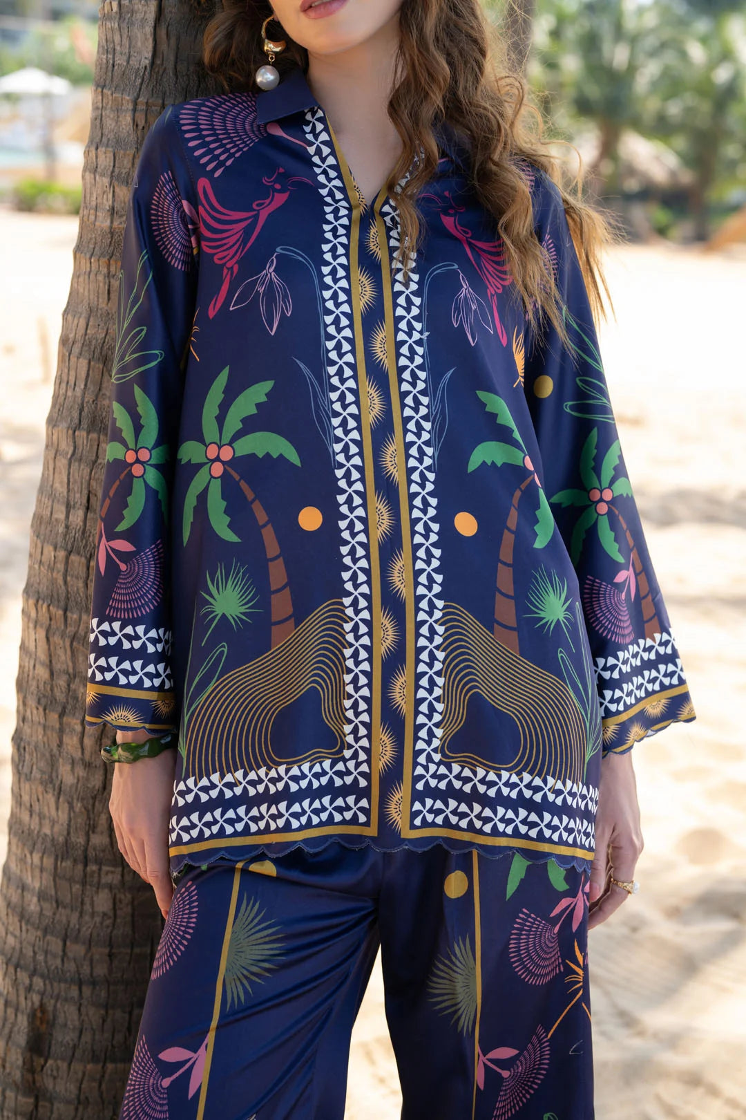 Full-length beach look of blue printed women’s co-ord set with matching shirt and trousers