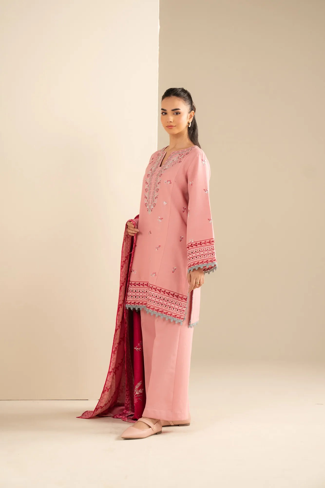 Full-length light pink khaddar outfit showing embroidered neckline and straight silhouette