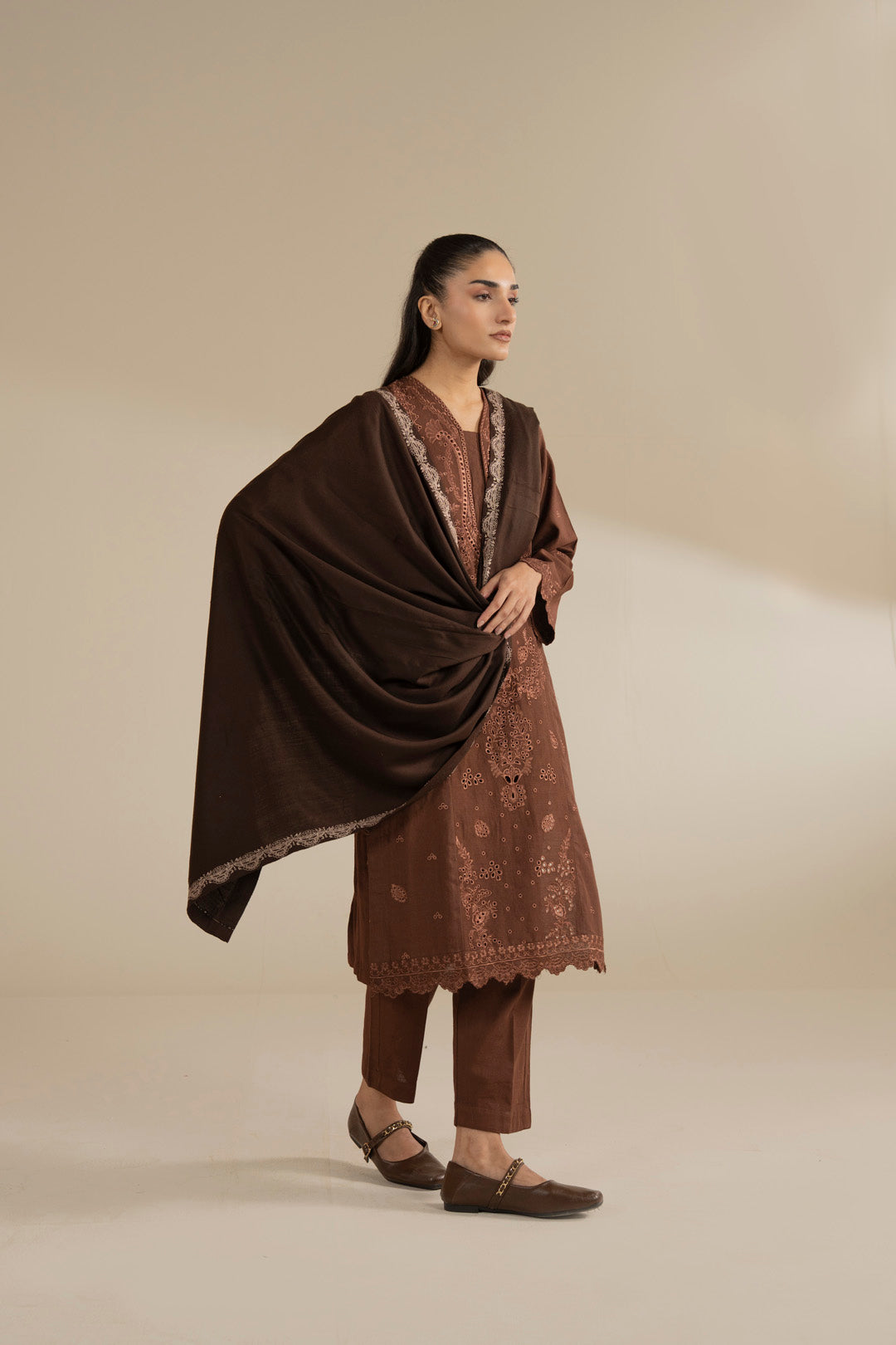 Full-length styling showing the shawl wrap and its coverage over shoulders and arms.