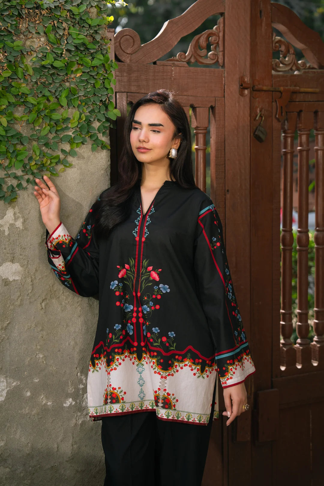 Full-length view of black ethnic printed ready-to-wear shirt