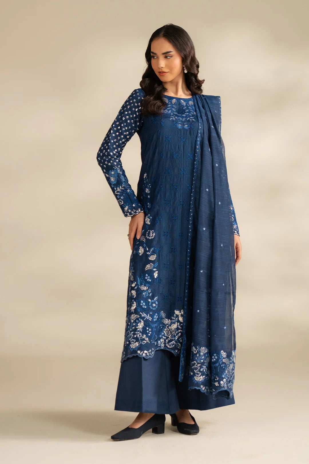 Full-length view of blue 3 piece formal suit for women