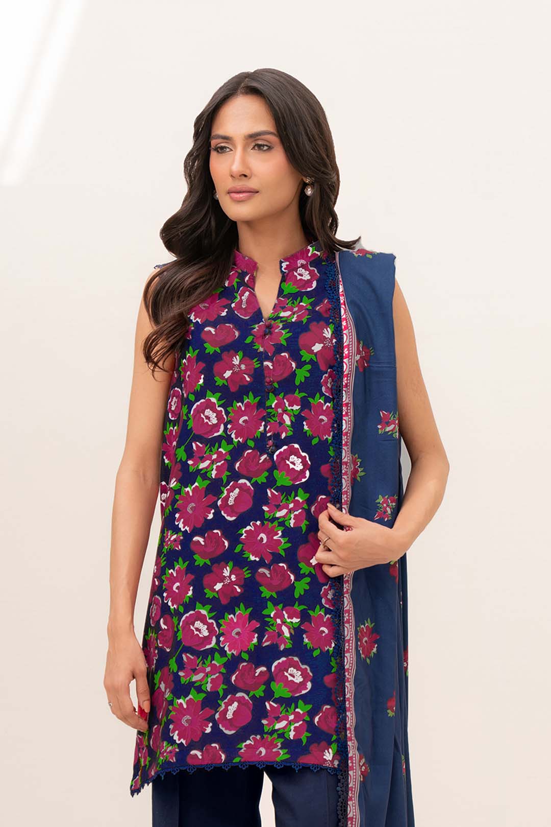 Full-length view of blue printed linen suit with coordinated dupatta drape, showing overall print placement.