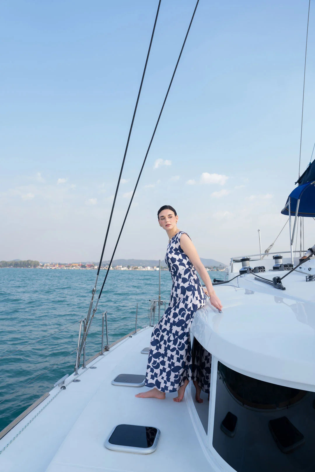 Full-length view of blue white one piece silk dress
