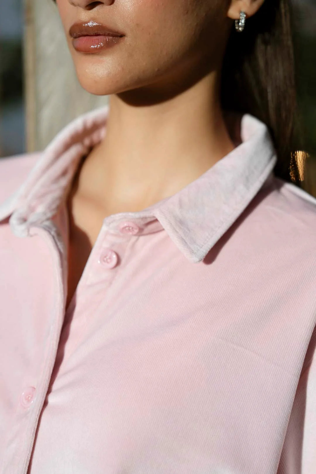 Full-length view of soft pink velvet co-ord set with hands-on-hips pose, showing straight trousers