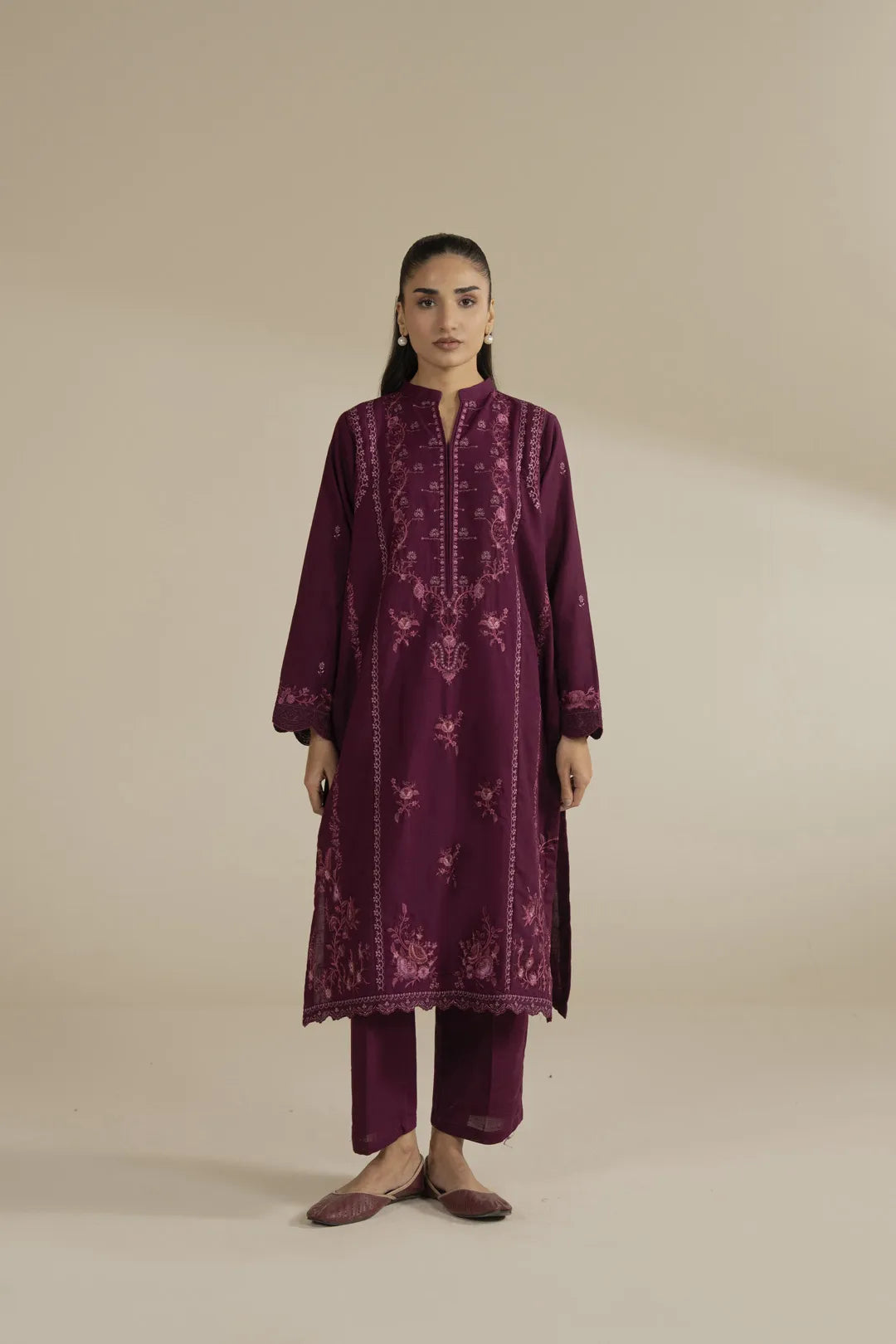 Full front view of pink embroidered khaddar 2 piece suit for women, winter wear.