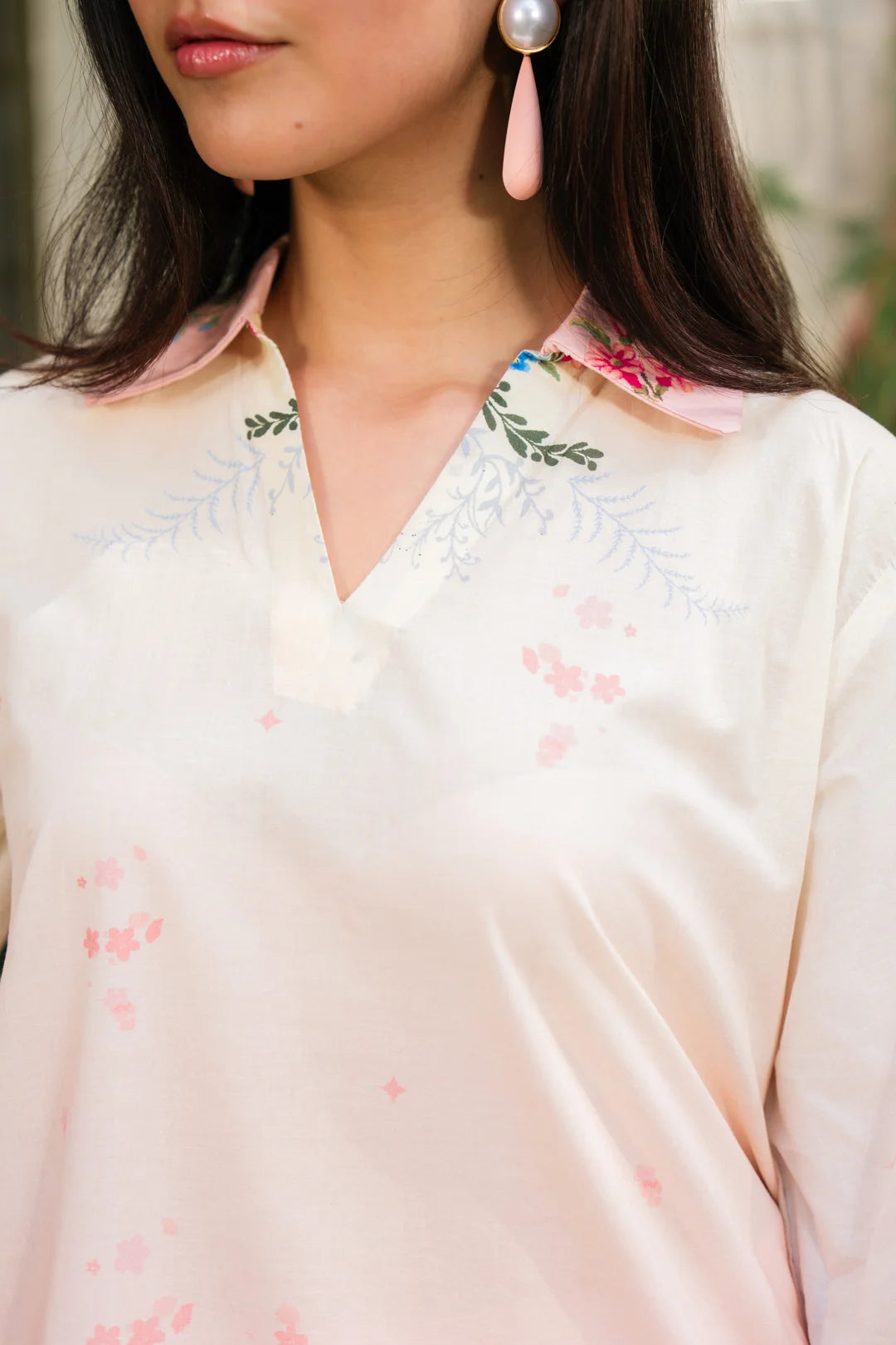 Full length view of blush pink silk co-ord set with printed trousers