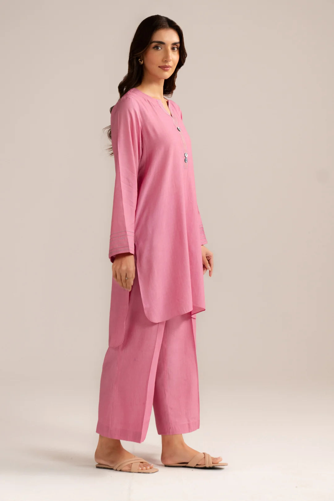 Full length view of light pink solid ready to wear 2 piece suit