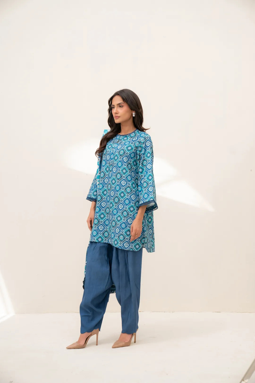 Full outfit view of teal printed linen shirt with dyed blue trousers (unstitched 3 piece)