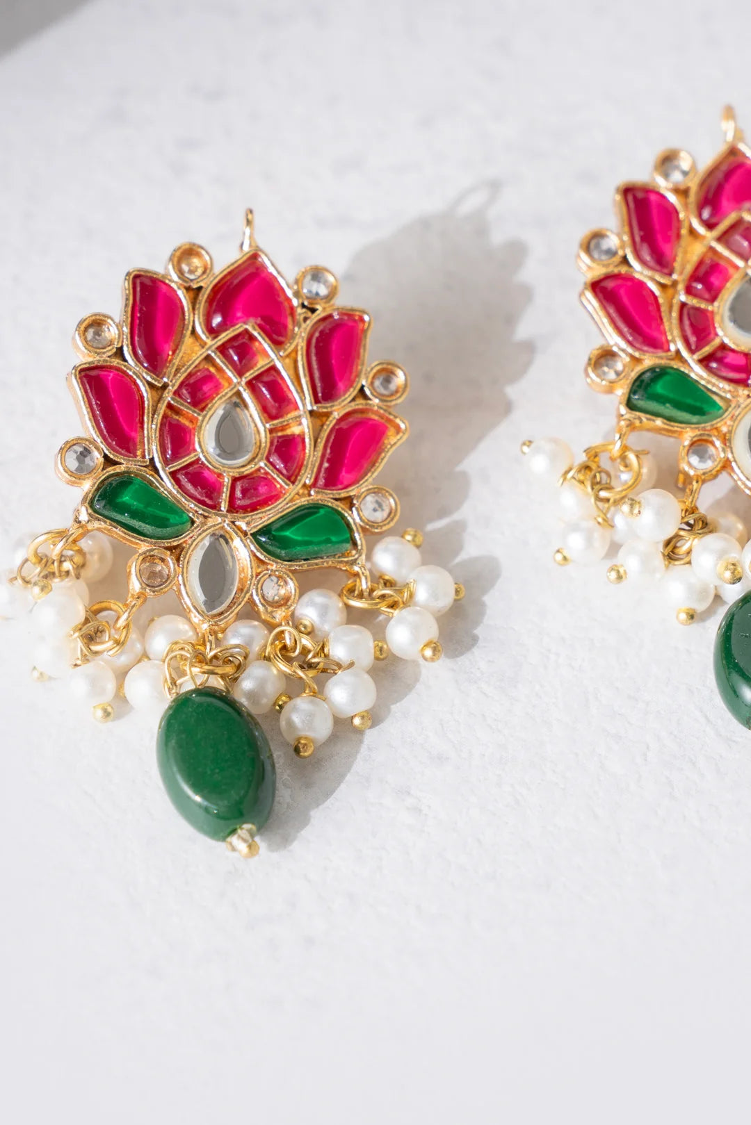 Gold Design Jhumka Traditional lotus-inspired meenakari earrings with pearls and green stone 