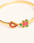 Gold flower kara bangle flatlay product photography Beyond East jewellery online women Pakistan