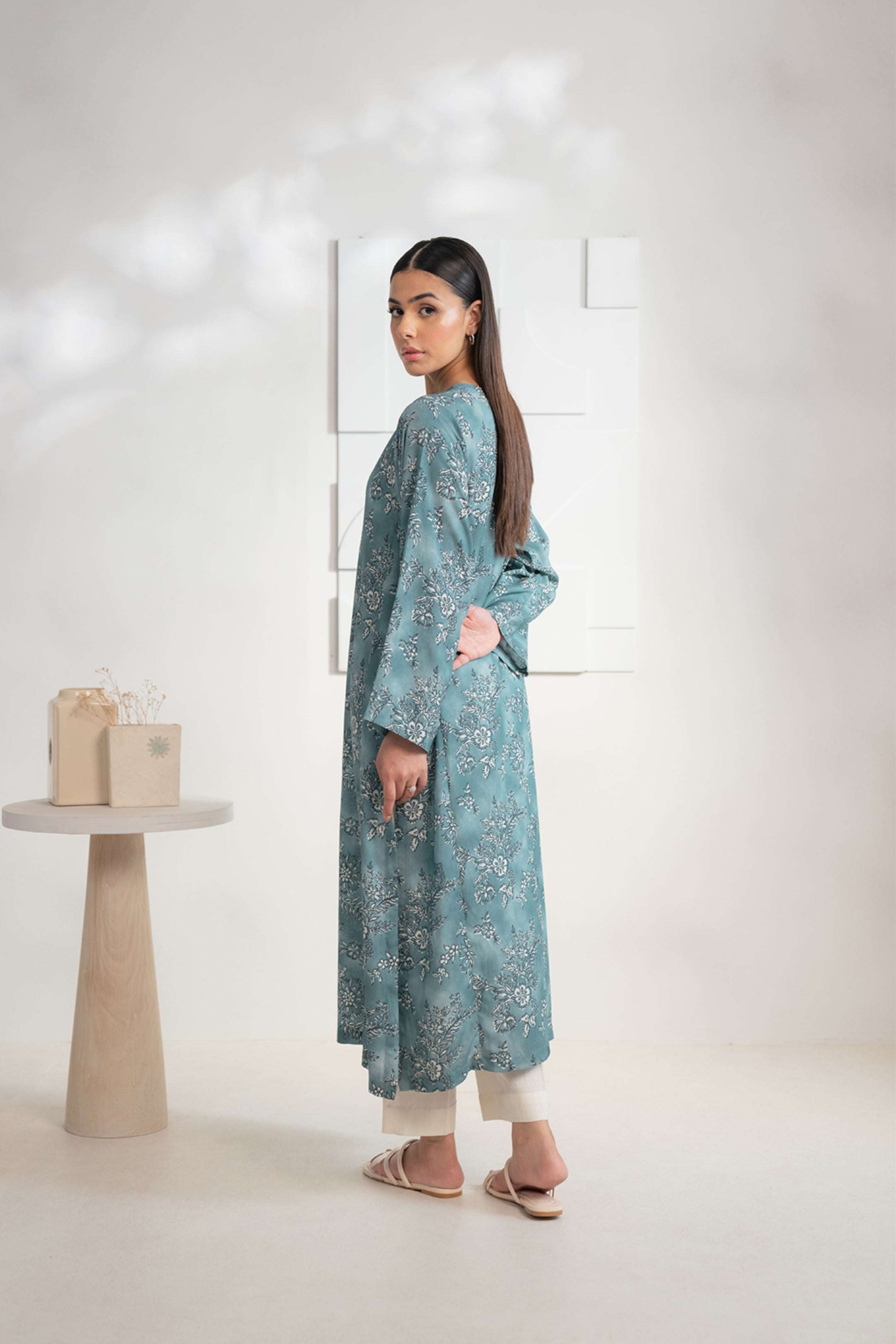 Ladies' teal base Karandi shirt featuring floral prints, ideal for a fine day; buy online now