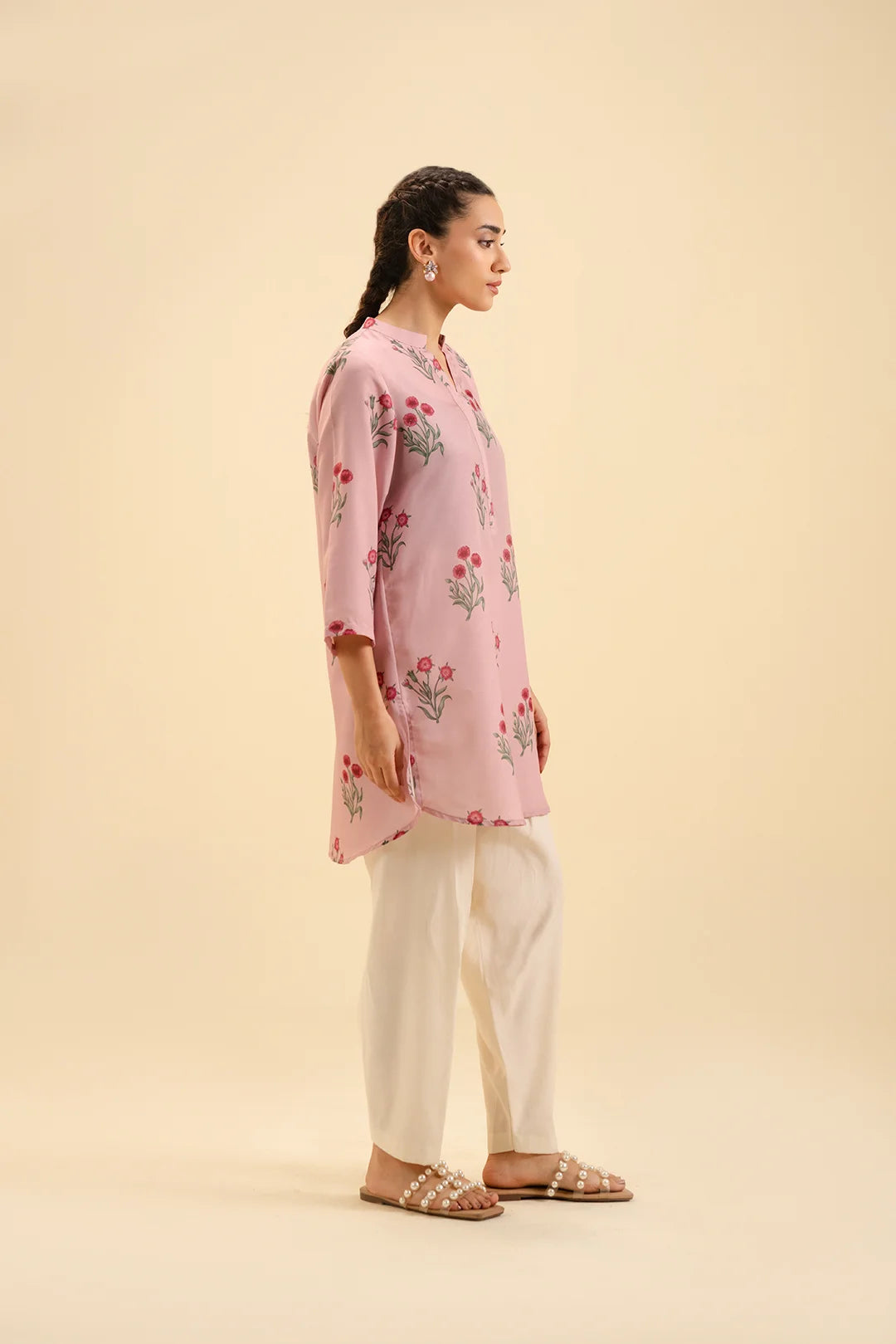 Latest Pakistani cambric shirts – trendy floral prints in soft pink fabric.