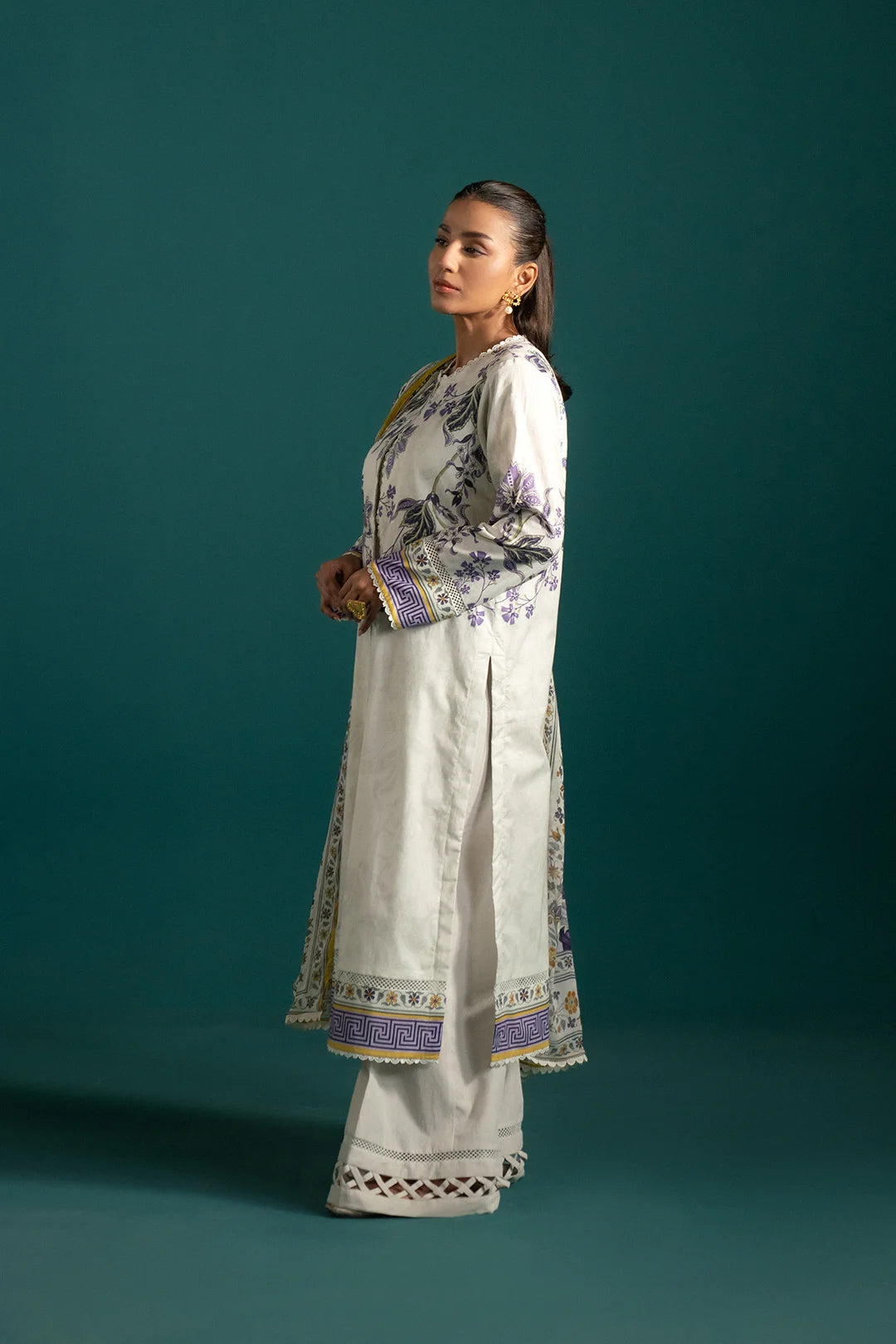 Latest lawn suits collection – an ethereal ash white printed lawn suit with purple and green accents, paired with a digitally printed chiffon dupatta.