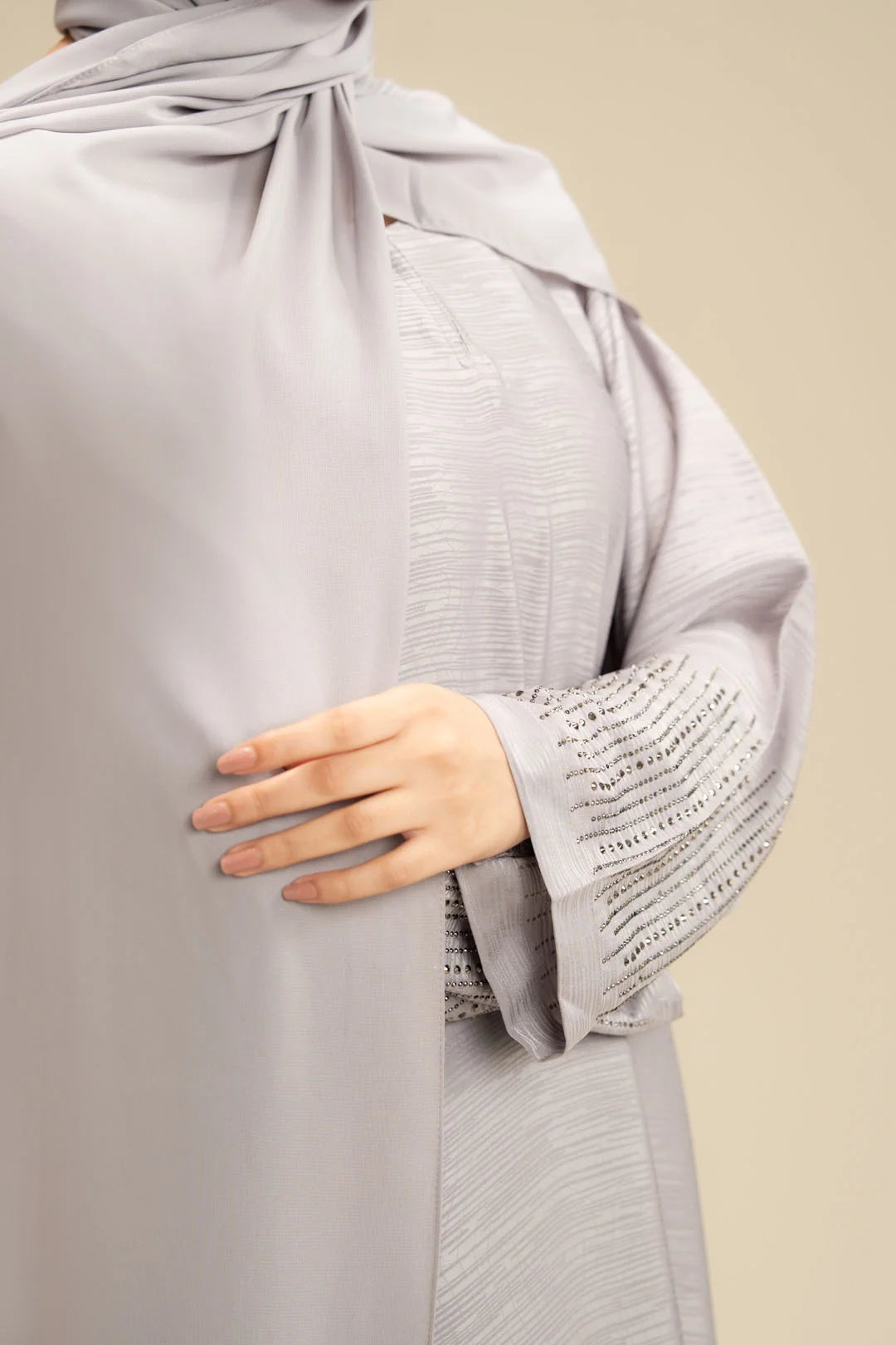 Light grey abaya design detail – simple embellished ladies abaya Beyond East