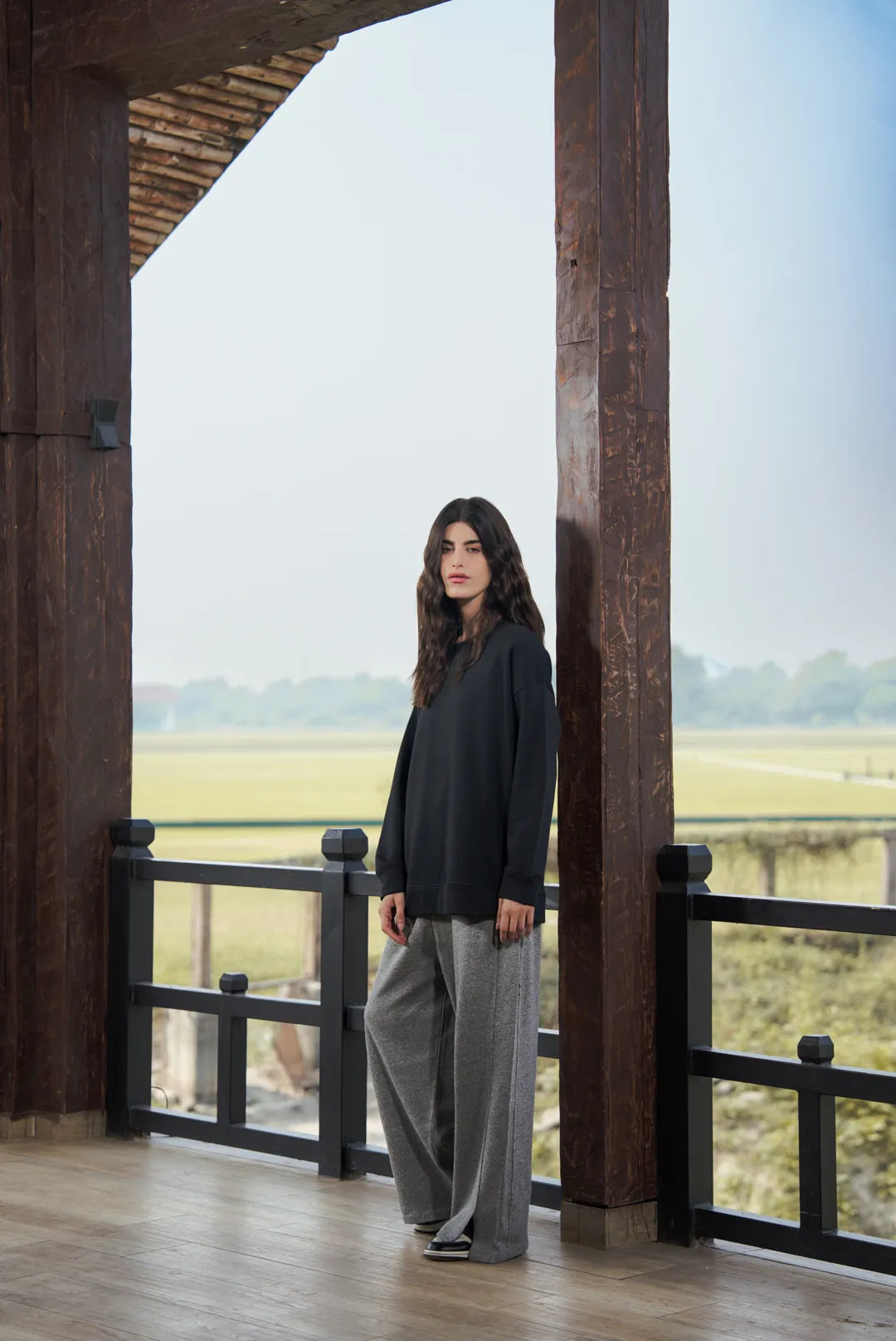 Long shot of black sweatshirt styling with relaxed proportions