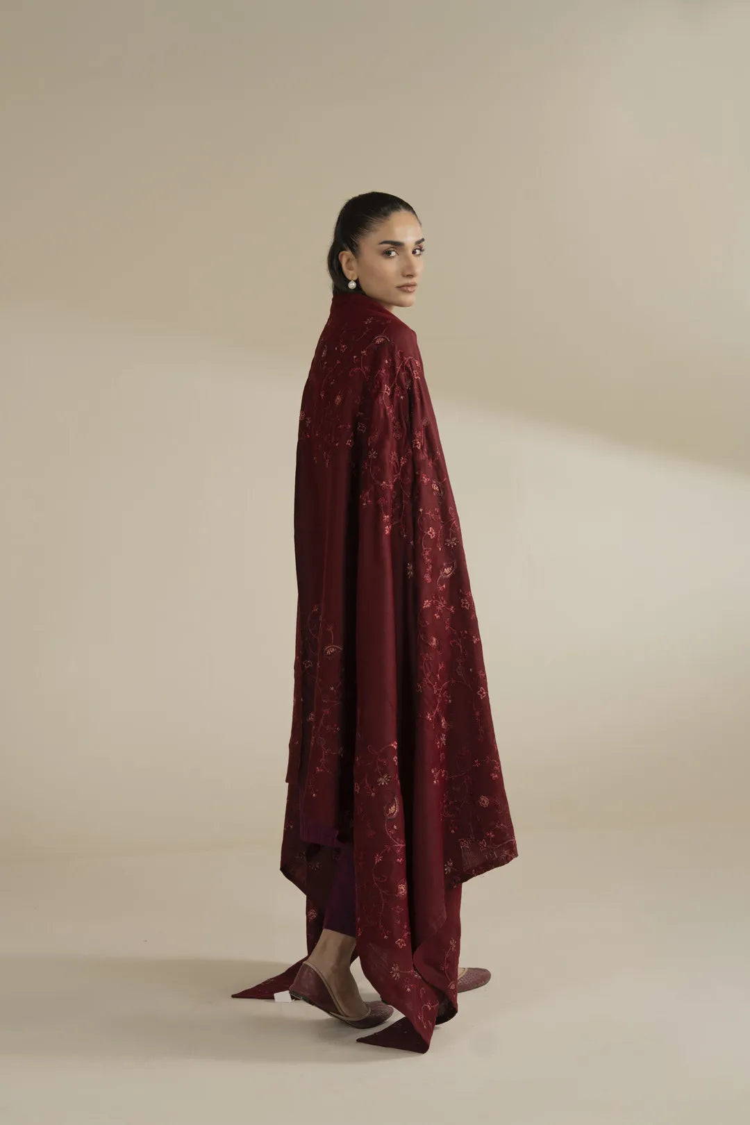 Long shot of maroon embroidered shawl with elegant winter styling