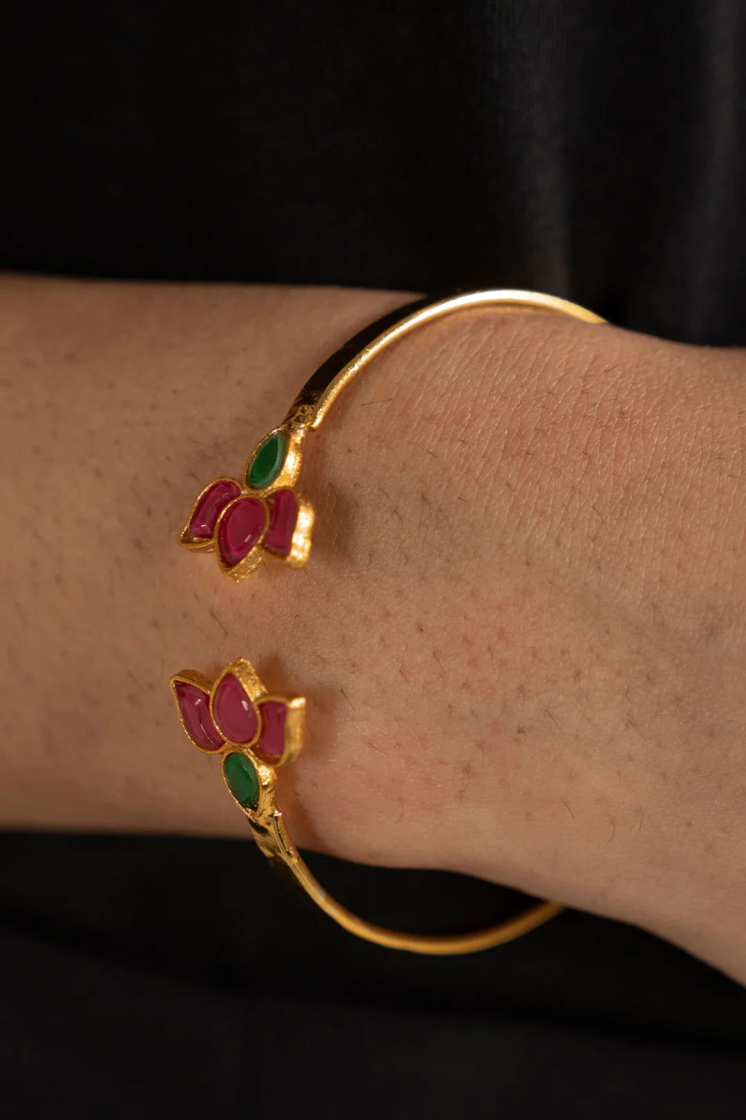 Lotus motif kundan bangle bracelet on wrist, festive jewelry for weddings and mehndi