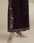 Lower half view of velvet kaftan showing embroidered side/hem border and drape
