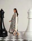 Side profile of ivory self embroidered 3 piece lawn suit with contrast black white dupatta from wuse261540