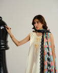 Standing pose ivory lawn kameez highlighting delicate self stitchwork paired with graphic printed dupatta Beyond East