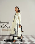 Front view of off-white lawn shirt featuring bold black embroidered neckline and sleeve borders from Beyond East