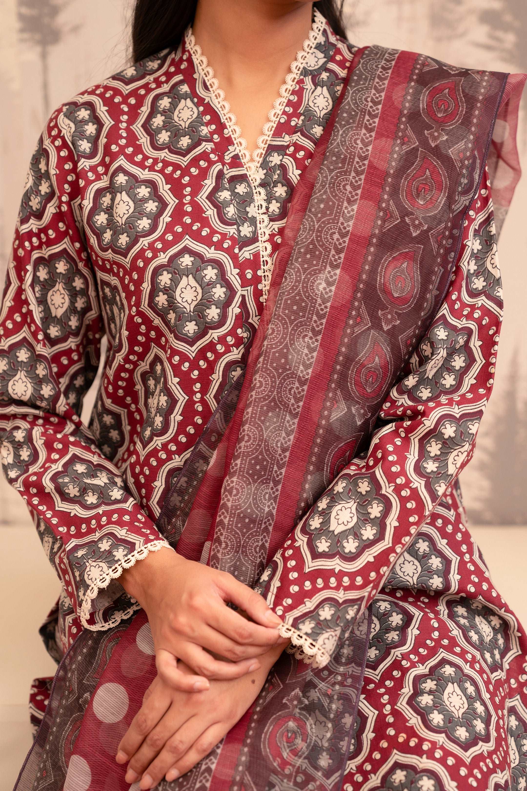 Maroon and grey printed kurta with lace detail, showcasing the fabric texture.