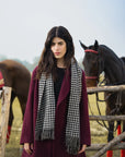 Maroon overcoat for women styled with scarf, winter outfit look