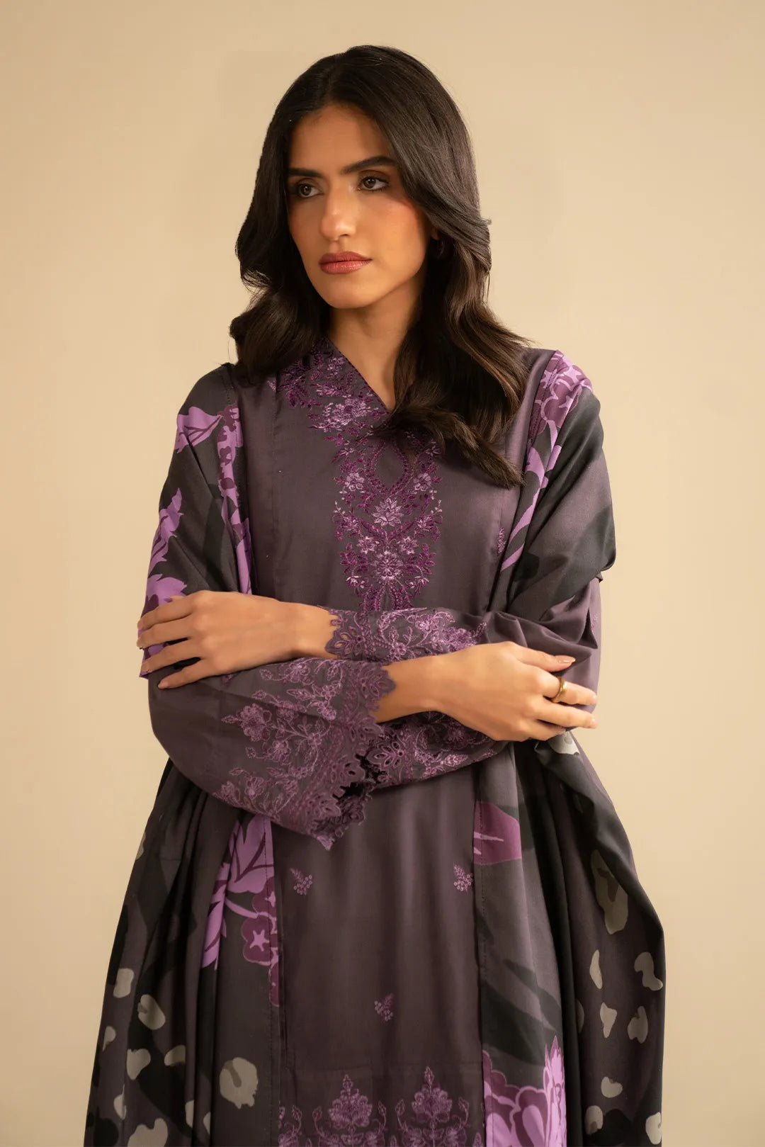 Model in purple embroidered linen suit with printed shawl, front pose highlighting embroidery placement