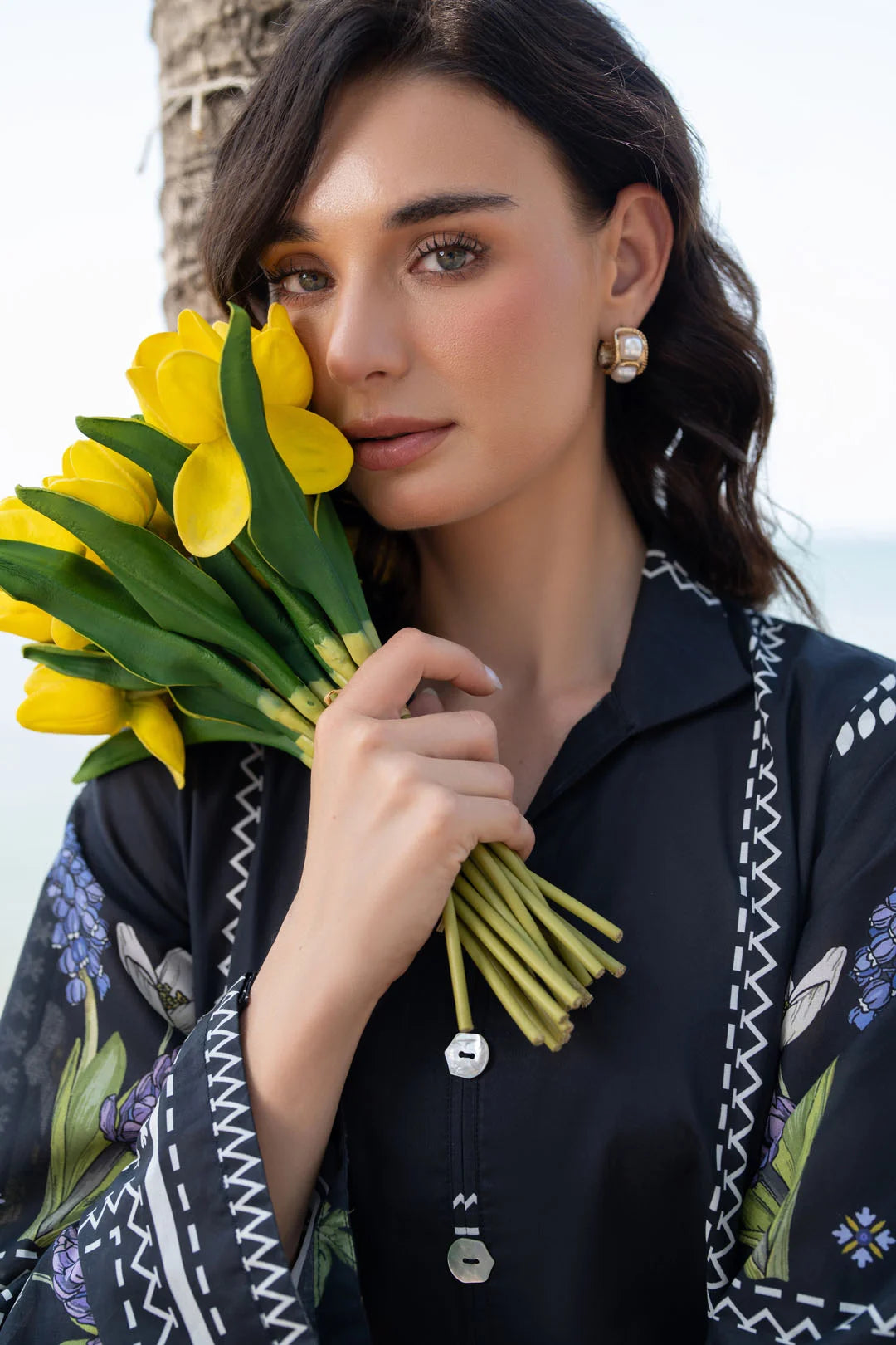 Model wearing black printed ready to wear matching co-ord set