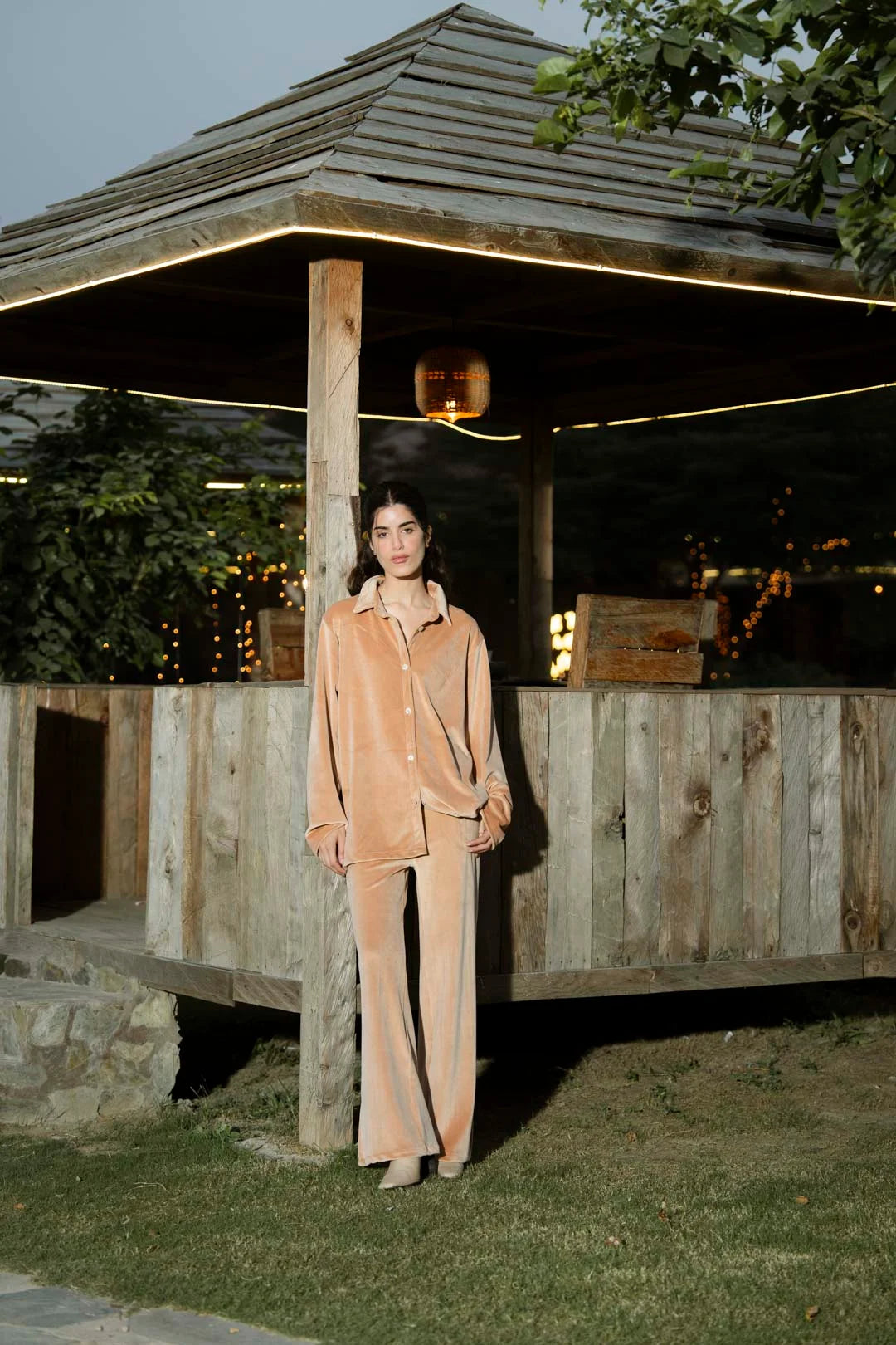 Model wearing camel velvet 2 piece co-ord set outdoors, full-length front view.