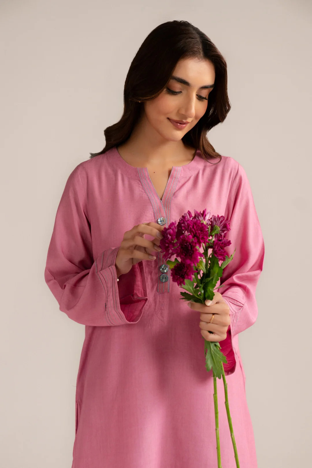 Model wearing light pink ready to wear linen 2 piece suit for women