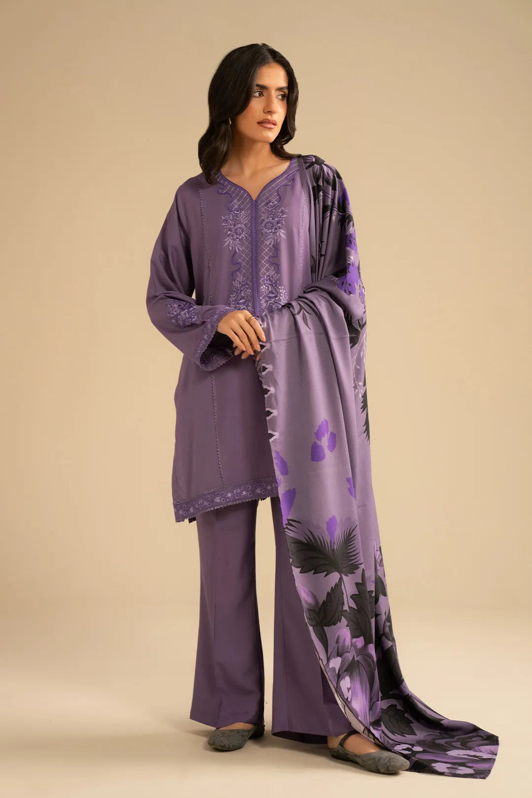 Model wearing light purple 3 piece embroidered linen suit with printed shawl, full front view in studio setting