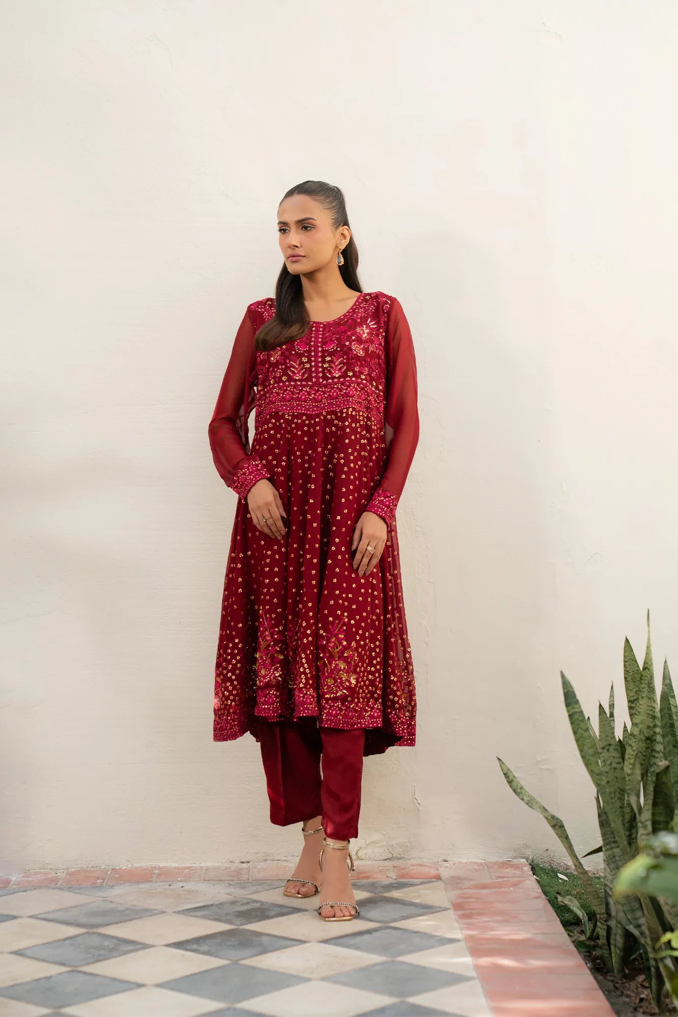 Model wearing maroon embroidered chiffon 3-piece suit with matching dupatta, full length view
