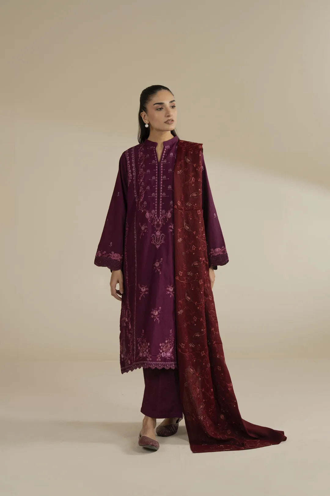 Model wearing maroon embroidered shawl full length with formal drape