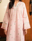 Model wearing pastel pink embroidered lawn shirt with cambric trouser