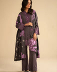 Model wearing purple 3 piece embroidered linen suit with printed shawl, full front view in studio setting