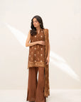 Model wearing rust brown printed linen 3-piece unstitched suit with matching dupatta